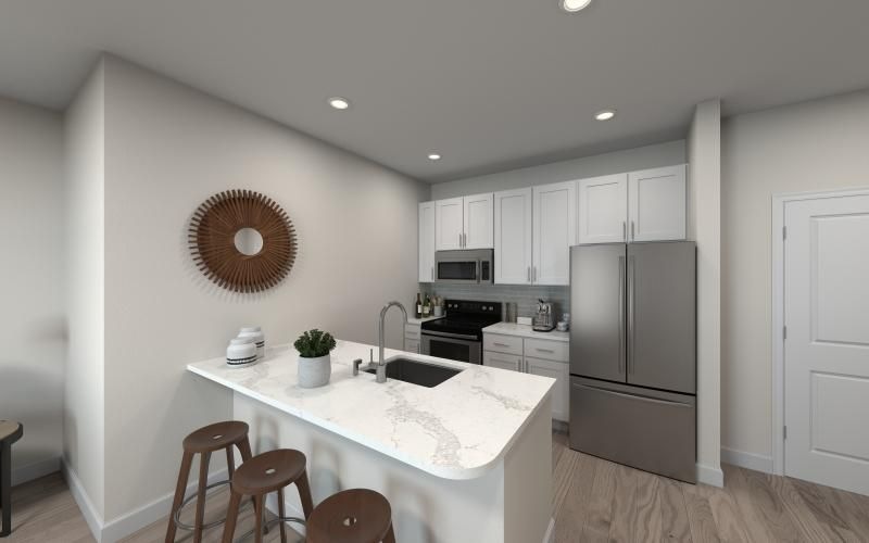 a kitchen with white cabinets